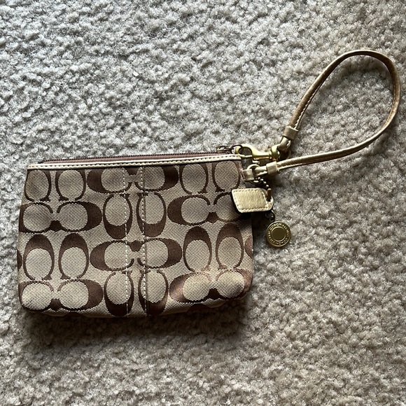 Coach wristlet with gold and flower accent - Picture 4 of 7